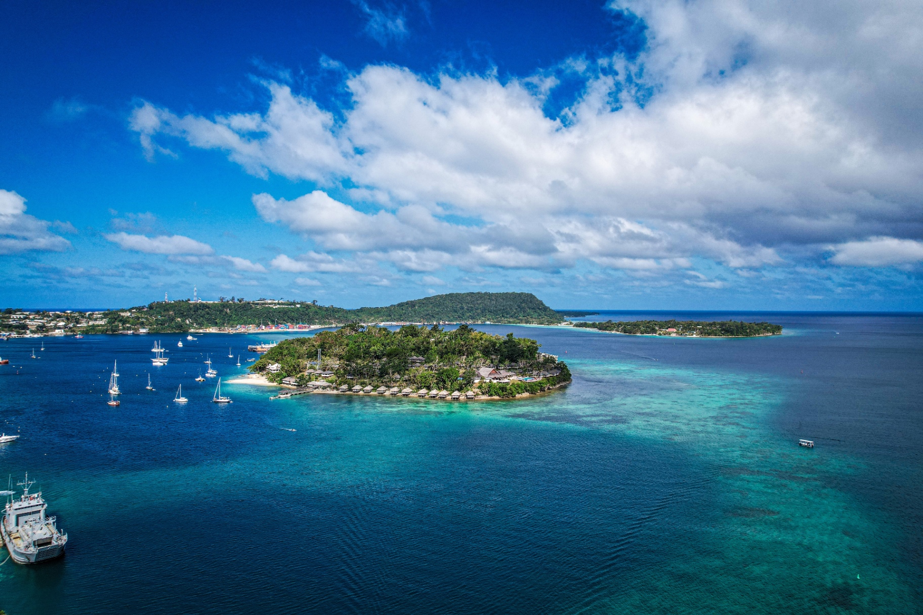 Aerial view of a Vanuatu tropical island with turquoise lagoon